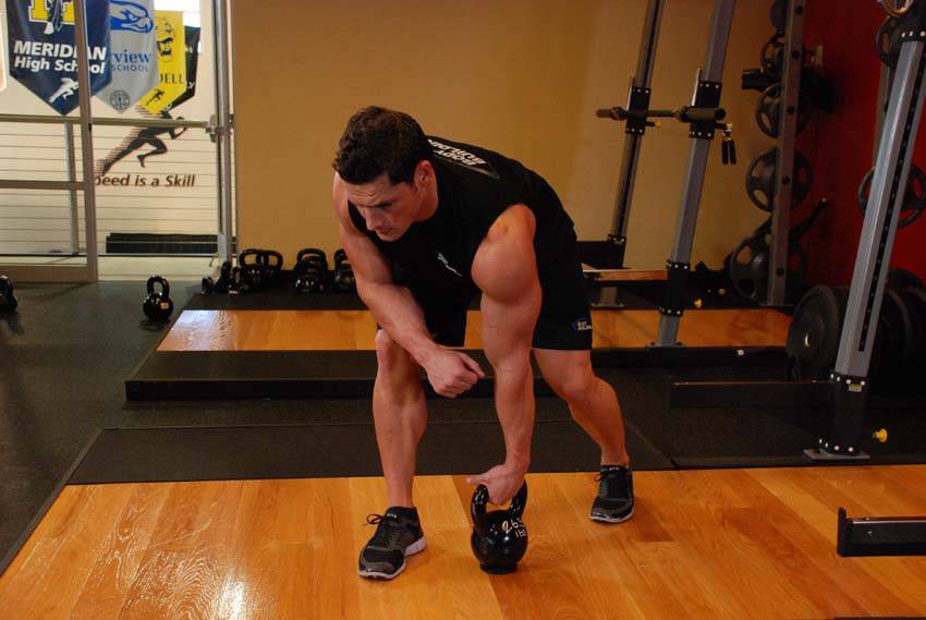 One-Arm Kettlebell Row, start position